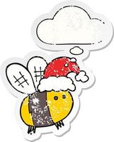 cute cartoon bee wearing christmas hat and thought bubble as a distressed worn sticker vector