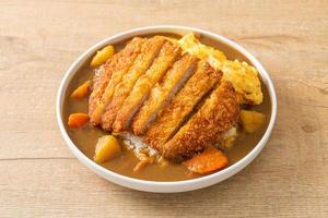 curry rice with fried pork cutlet and creamy omelet photo