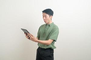 young Asian man using tablet photo