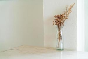 dried flowers decoration in glass vase photo