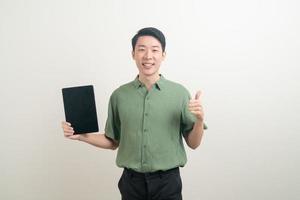 young Asian man using tablet photo