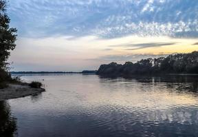 Beautiful landscape at a lake with a reflective water surface photo