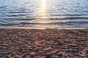 Beautiful landscape at a lake with a reflective water surface photo