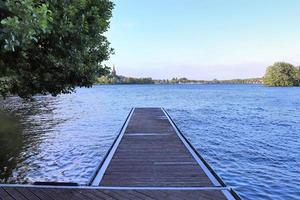 Beautiful landscape at a lake with a reflective water surface photo