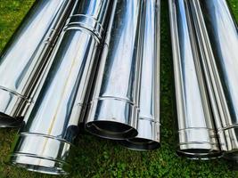 Close up view at a lot of reflective chrome metal tubes photo