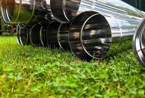 Close up view at a lot of reflective chrome metal tubes photo