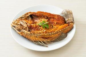 Fried Sea Bass Fish with Garlic photo