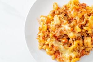 homemade macaroni bolognese with cheese photo