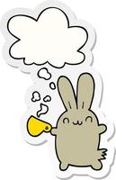 cute cartoon rabbit drinking coffee and thought bubble as a printed sticker vector