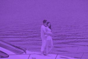 young couple on yacht photo