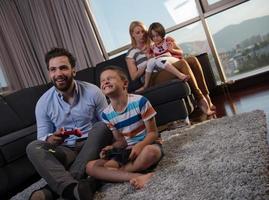 Happy family playing a video game photo