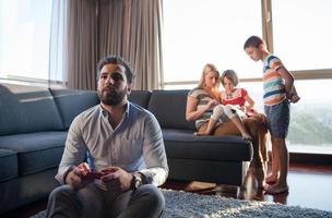 Happy family playing a video game photo