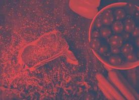 top view of raw steak on wooden table photo