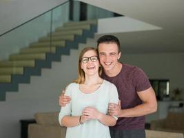 couple hugging in their new home photo