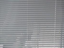 Horizontal aluminum blinds installed on the balcony photo