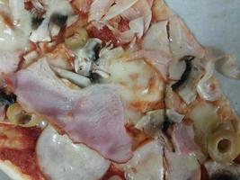 Pieces of pizza with cheese and crust photo