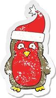 retro distressed sticker of a cartoon christmas robin wearing santa hat vector