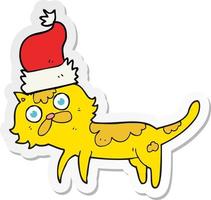 sticker of a cartoon cat wearing christmas hat vector