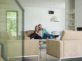 couple relaxes in the living room photo