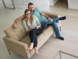 couple relaxes in the living room photo