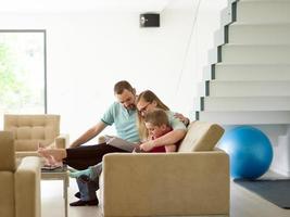 family with little boy enjoys in the modern living room photo