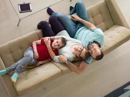 family with little boy enjoys in the modern living room photo