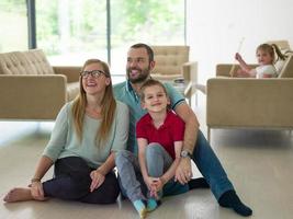 family with little boy enjoys in the modern living room photo