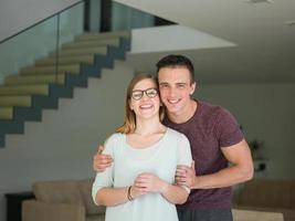 couple hugging in their new home photo