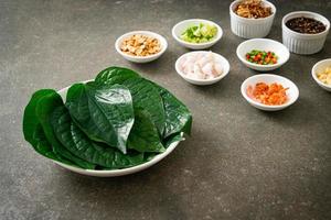 Miang kham - A royal leaf wrap appetizer photo