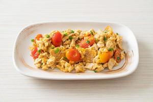 stir-fried tomatoes with egg on plate photo