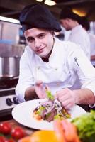 cook chef decorating garnishing prepared meal photo