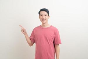 Asian man with hand pointing or presenting on white background photo