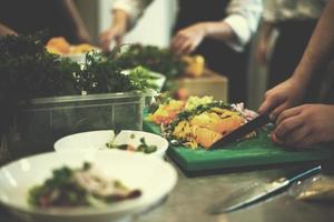 team cooks and chefs preparing meals photo