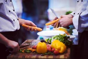 chefs hands cutting carrots photo