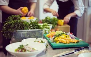 team cooks and chefs preparing meals photo