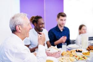 modern muslim grandfather eating dates photo