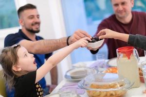 Eid Mubarak islamic family have Iftar dinner during Ramadan fest photo