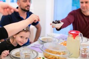 Eid Mubarak islamic family have Iftar dinner during Ramadan fest photo