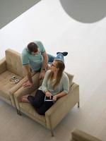 couple relaxing at  home with tablet computers photo