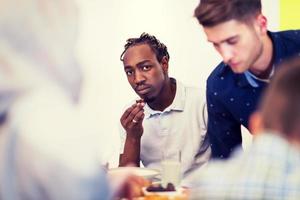 black man enjoying iftar dinner with family photo