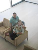 couple relaxing at  home with tablet computers photo