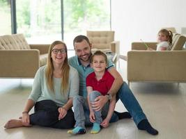 family with little boy enjoys in the modern living room photo