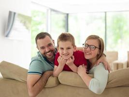 family with little boy enjoys in the modern living room photo