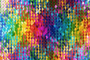 Sequins background. Multicolored sequins. Background with shiny sequins on fabric. photo