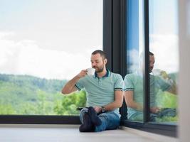 man on the floor enjoying relaxing lifestyle photo