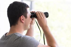 Man with binoculars photo