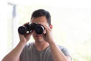 Man and binoculars photo