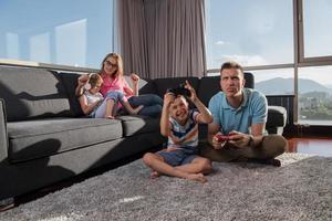 Happy family playing a video game photo