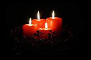 four red christmas candles photo