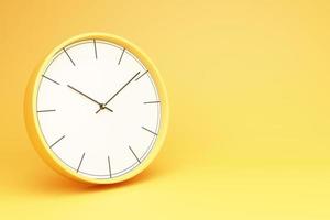 yellow alarm clock on yellow background photo